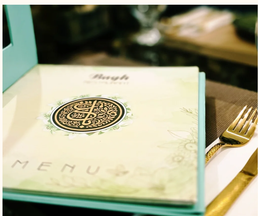 Bagh Restaurant's physical menu on a dining table